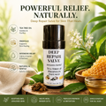A stick container of Deep Repair Salve with tea tree and propolis, displayed on a rustic wooden slice alongside honeycomb, liquid honey, and raw propolis chunks against a bright, leafy outdoor background.